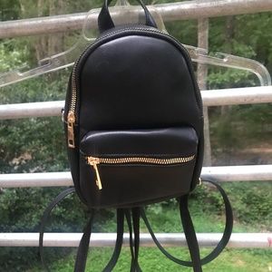Mini faux leather backpack with gold accents